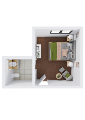Top-down view of a small bedroom with a double bed, two nightstands, a brown rug, a chair with a small table, and an attached bathroom with a toilet and sink. The room has windows and minimal decor.